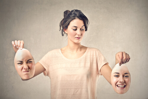 Woman Holding Happy and Angry Faces