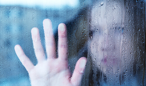 Woman with Hand on Window