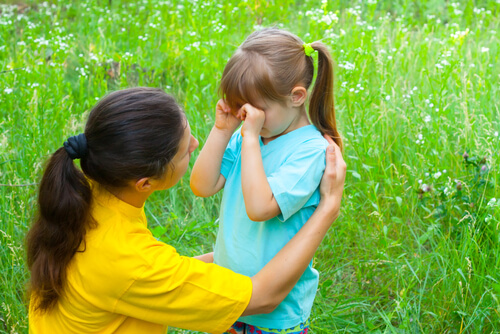 child-crying-while-mother-is-trying-to-calm-her