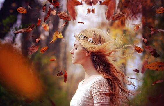 girl-in-fall-woods-wind-in-hair
