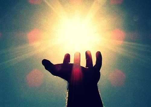 hand with a beam of light