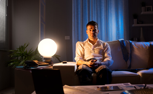 man awake on couch
