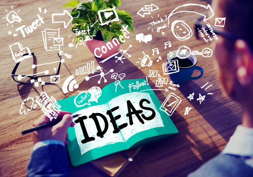 man-writing-his-ideas-in-a-notebook