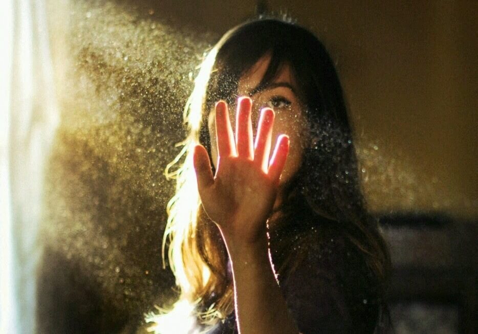 Woman Touching Beam of Light