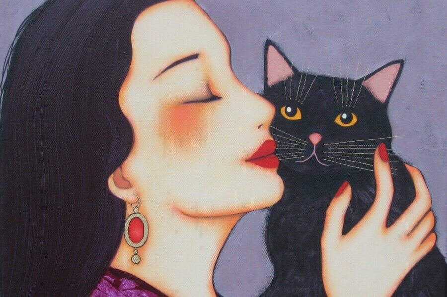 woman and black cat
