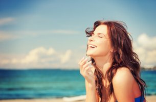 Woman Laughing at Beach