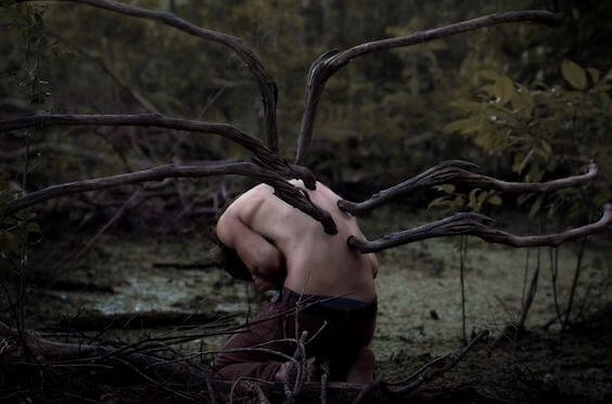 branches growing out of boys back