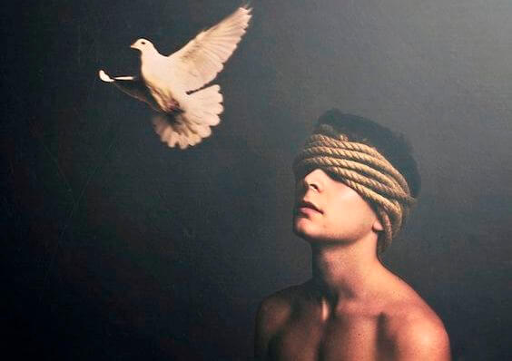 man-with-eyes-covered-by-rope