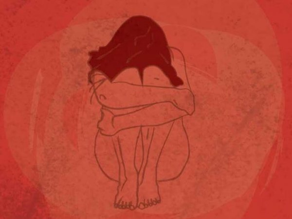 Woman Curled Up In Pain