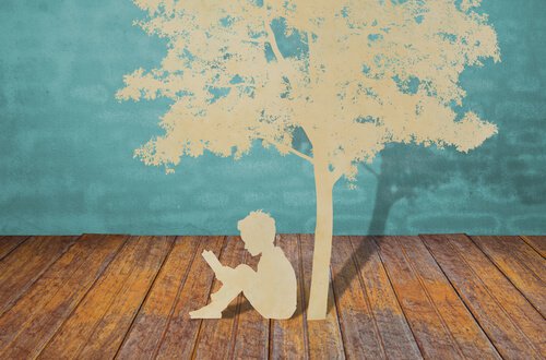 paper-cutout-child-reading-under-tree