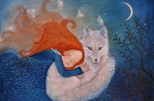 redheaded-girl-hugging-white-fox