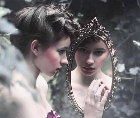 woman looking in the mirror