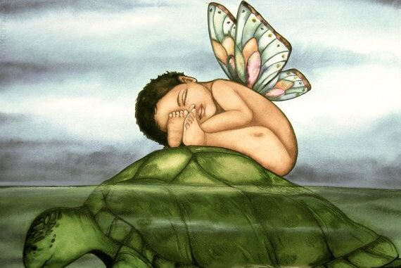 baby with wings on a turtle