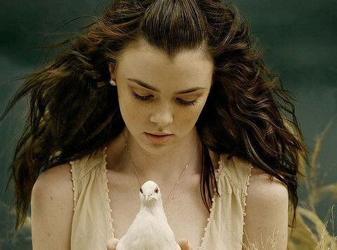 girl holding bird