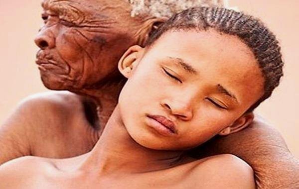 old woman holding child