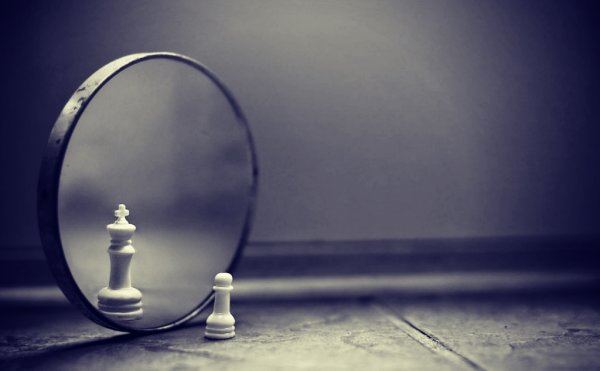 pawn looking in the mirror