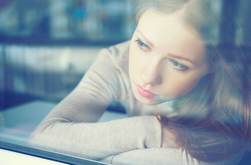 woman-feeling-guilty-looking-out-the-window