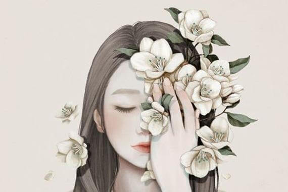 woman holding flowers to her face