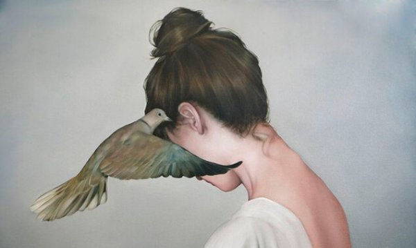 bird whispering to woman