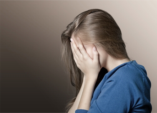 girl-covering-face-with-her-hands