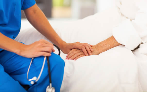 nurse-holding-patients-hand