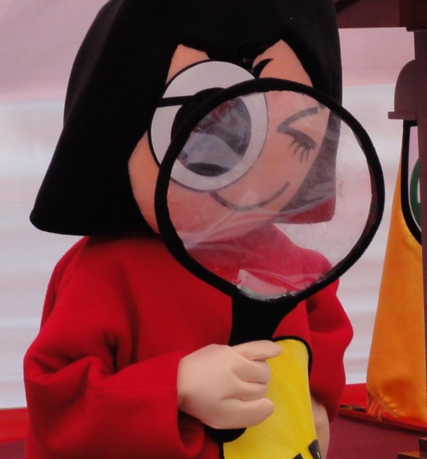 puppet with magnifying glass
