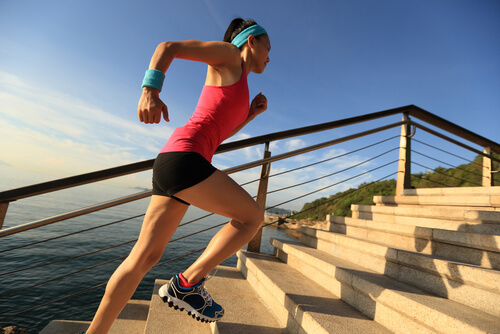 woman running up stairs