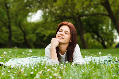 Woman Relaxing in Grass