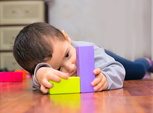 boy playing with blocks