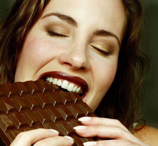 Woman Eating Chocolate
