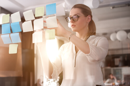 girl looking at postits
