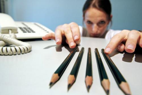 woman fixing pencils