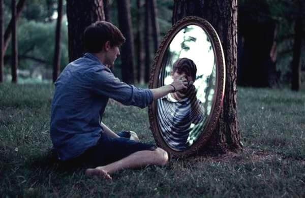 man looking in mirror