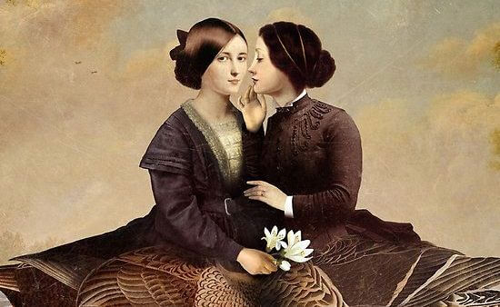 woman whispering to another