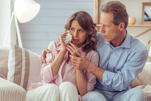 couple of parents crying