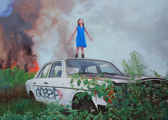 girl standing on car