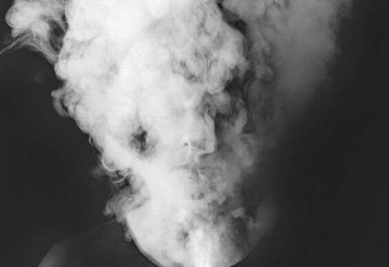 head covered in smoke