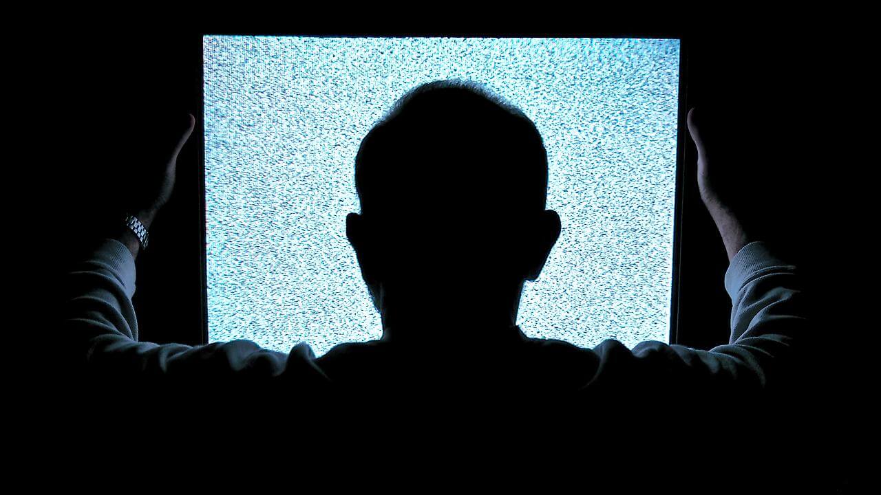 man staring at blank screen