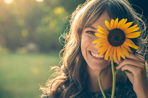 Smiling Woman with Sunflower
