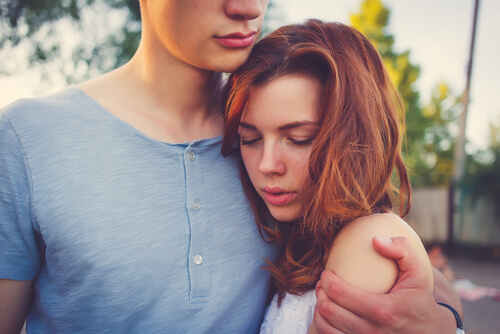 girl in boy's arm