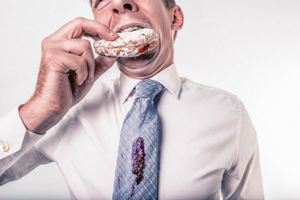 man eating donut