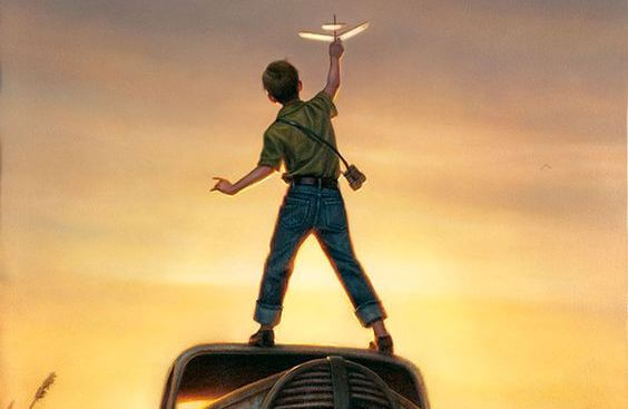 child playing with an airplane