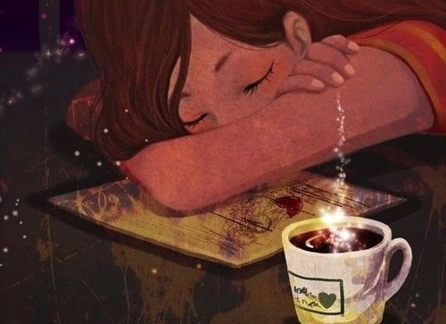 girl napping next to coffee cup