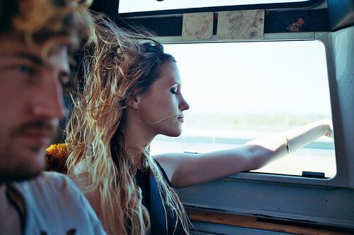 girl with hand out the window