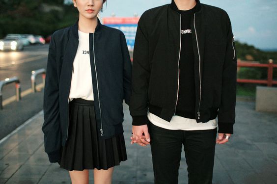 couple dressed in black holding hands
