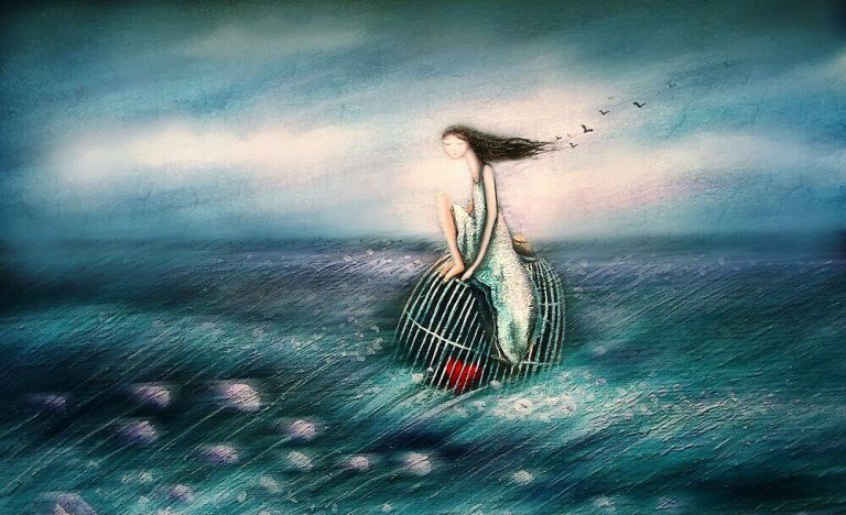 girl floating on a caged heart in the ocean