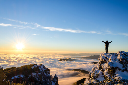 man on a cliff by the sea