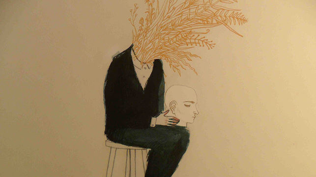 man with head in lap and grain in neck