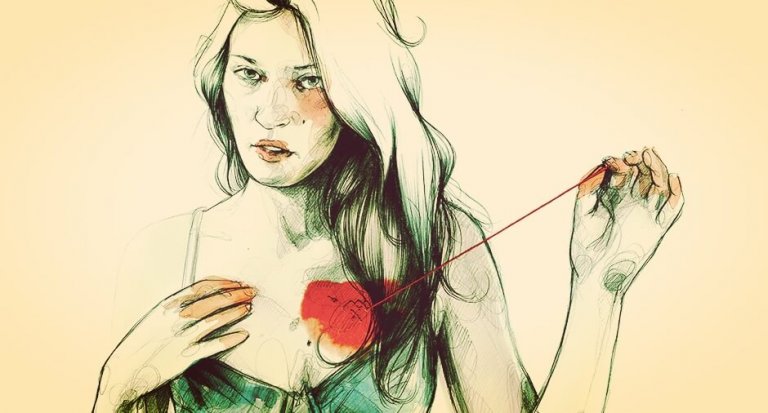 woman sewing up heart