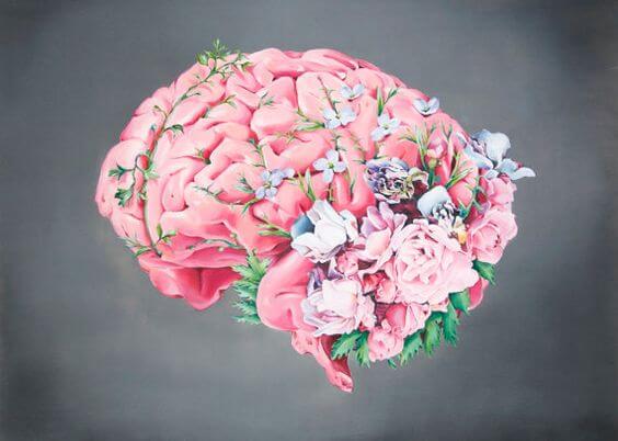 A brain is covered in colorful flowers.